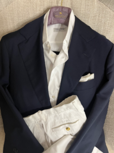 Navy jacket style with white trousers combination